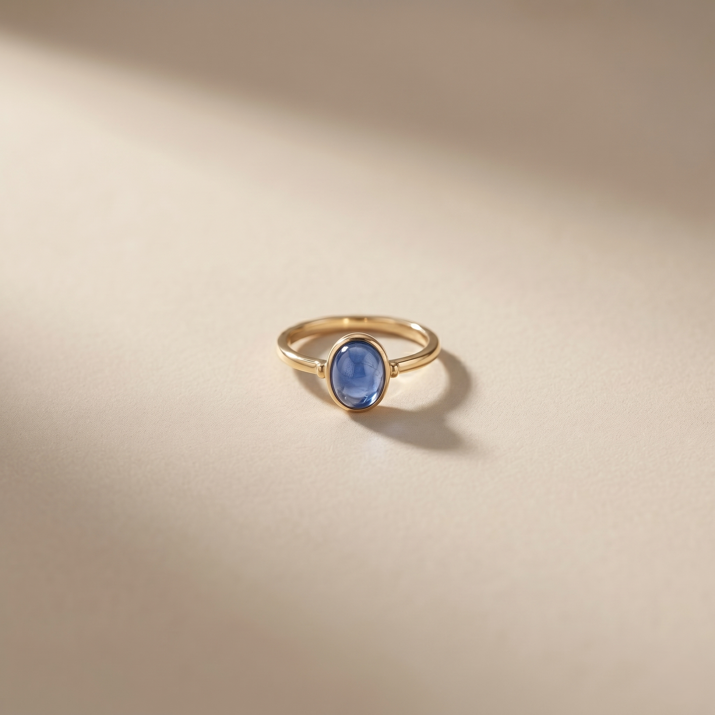 Oval Blue Cabochon Gold Solitaire Ring