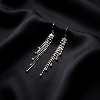 Elegance in Motion: Silver Tassel Drops