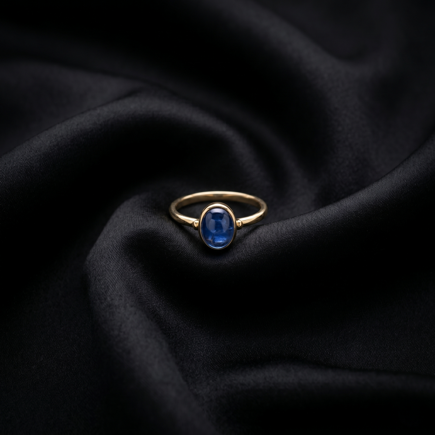 Oval Blue Cabochon Gold Solitaire Ring
