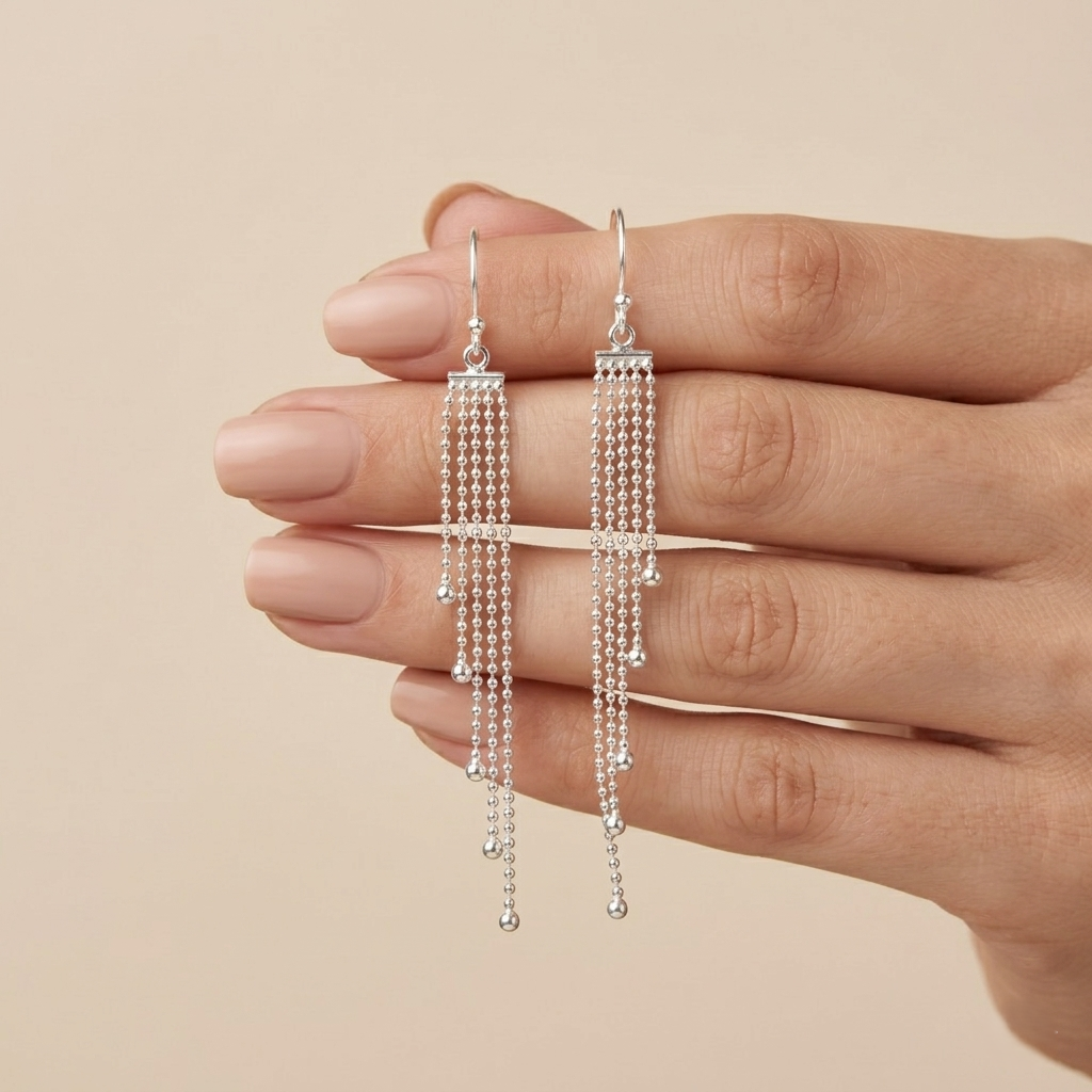 Elegance in Motion: Silver Tassel Drops