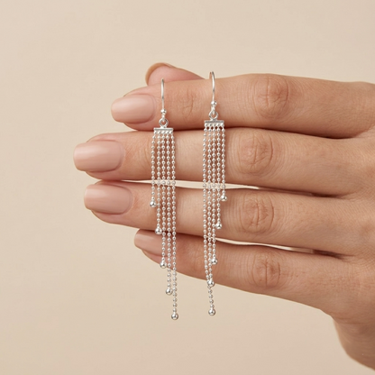 Elegance in Motion: Silver Tassel Drops