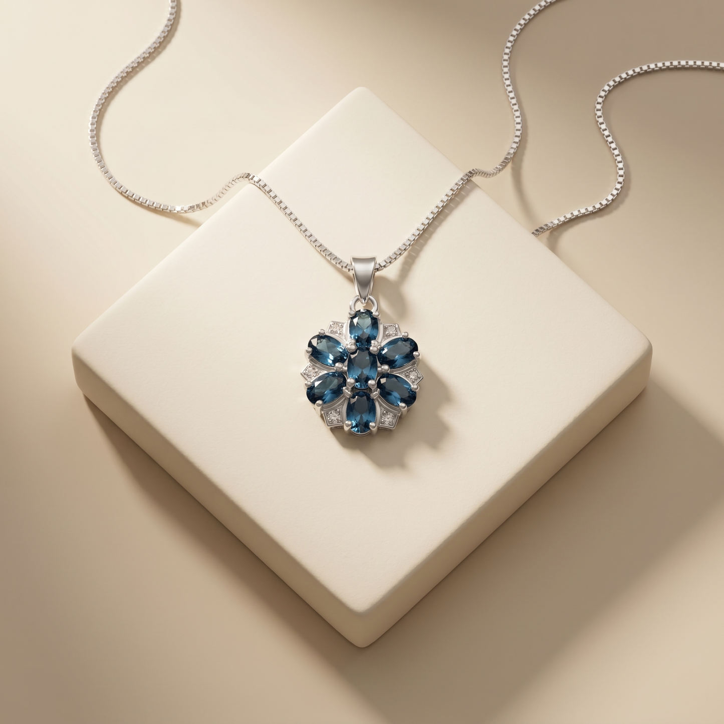 Elegant Silver Floral Blue Topaz Pendant