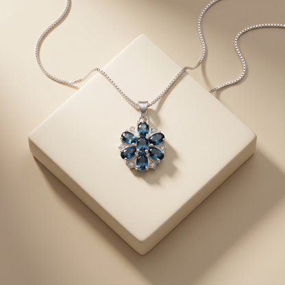 Elegant Silver Floral Blue Topaz Pendant