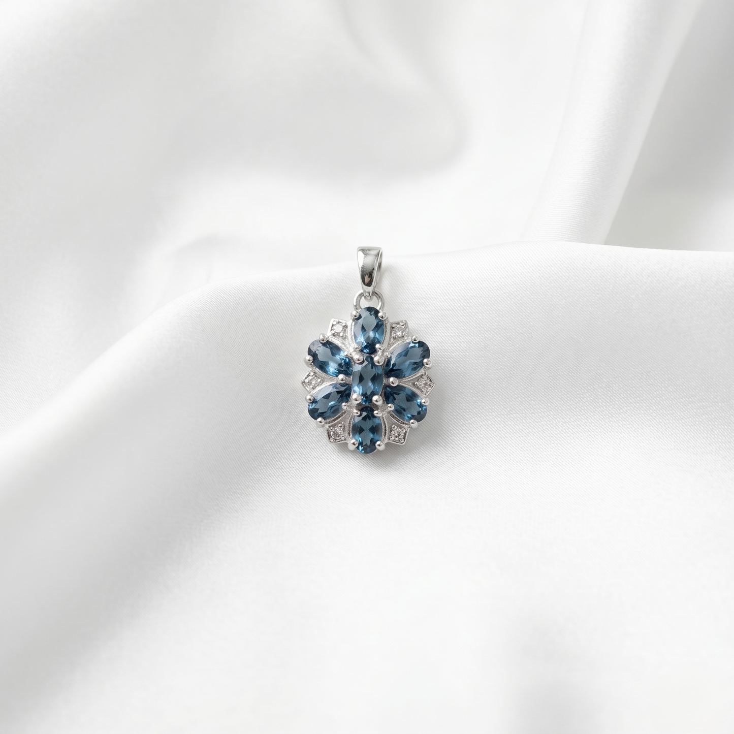 Elegant Silver Floral Blue Topaz Pendant