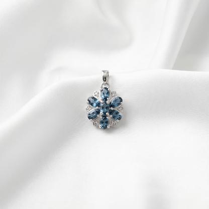 Elegant Silver Floral Blue Topaz Pendant