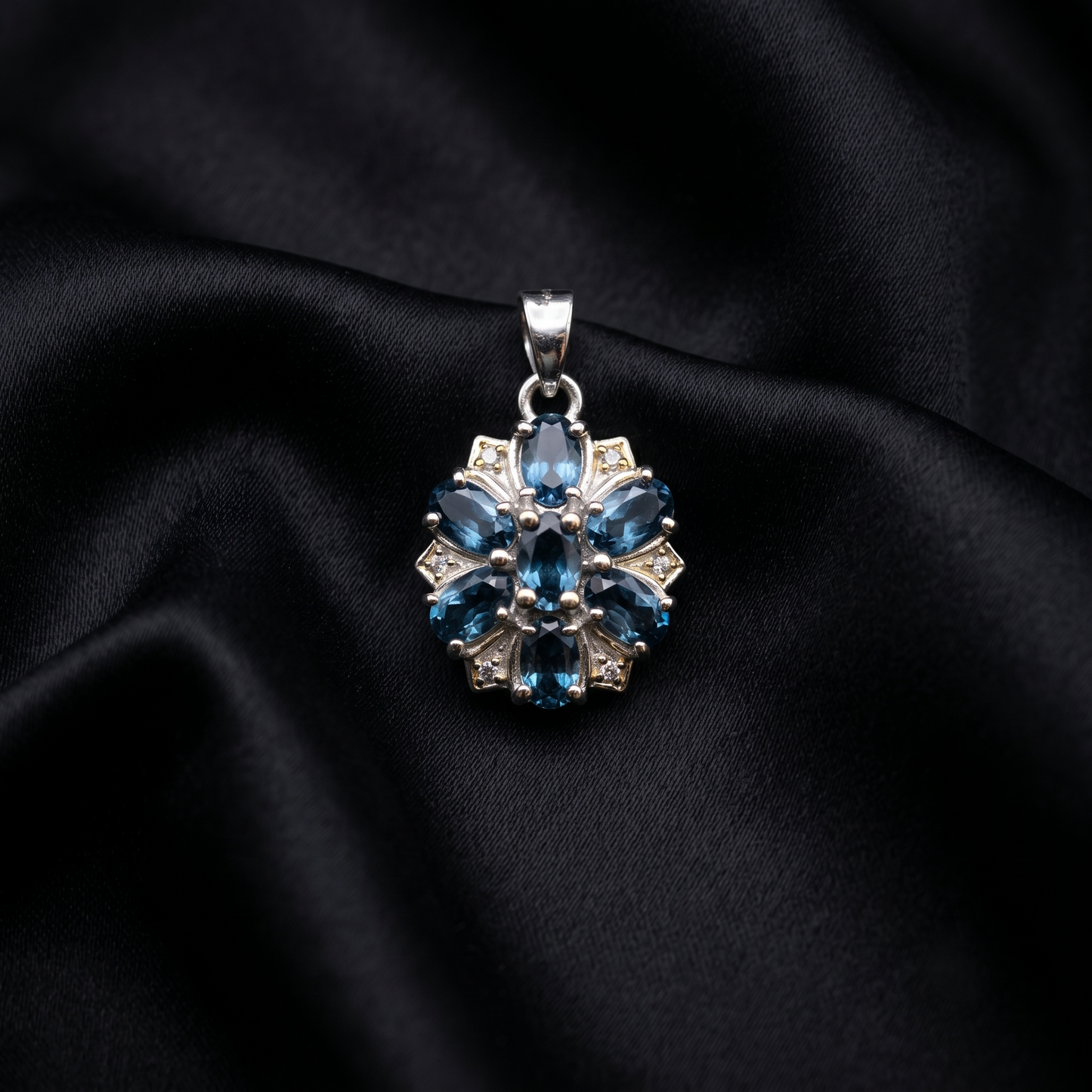Elegant Silver Floral Blue Topaz Pendant