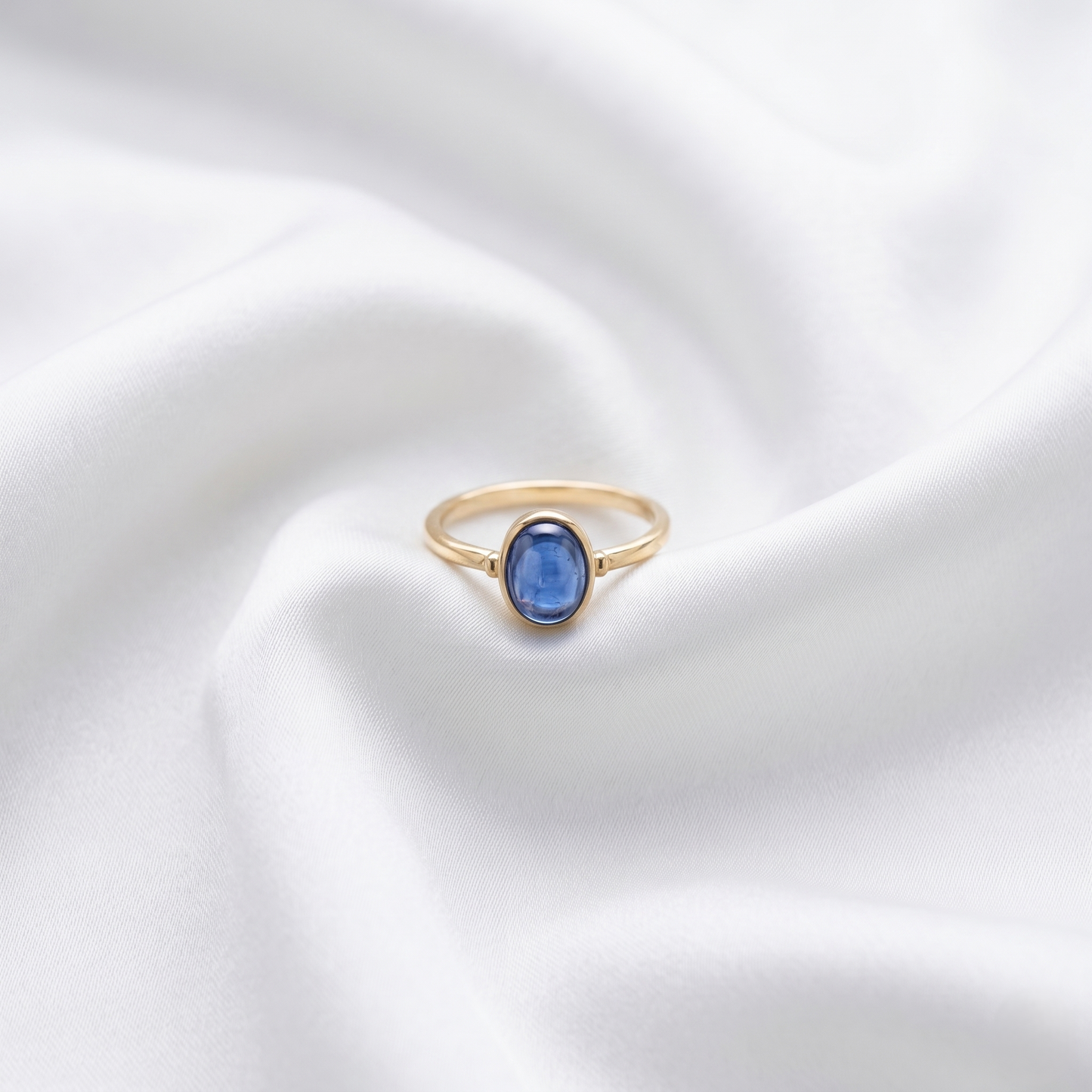 Oval Blue Cabochon Gold Solitaire Ring